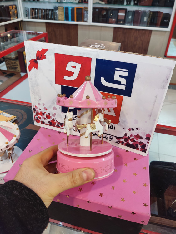 کراسل کوکی و گردان موزیکال رنگ صورتی و سفید